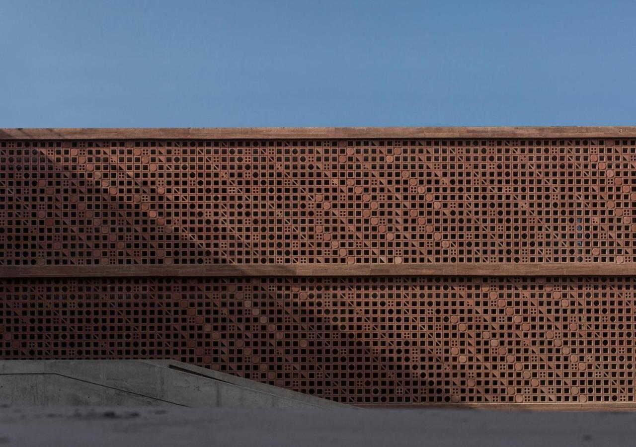 Potato Head Suites&Studios Seminyak Esterno foto The perforated brick facade